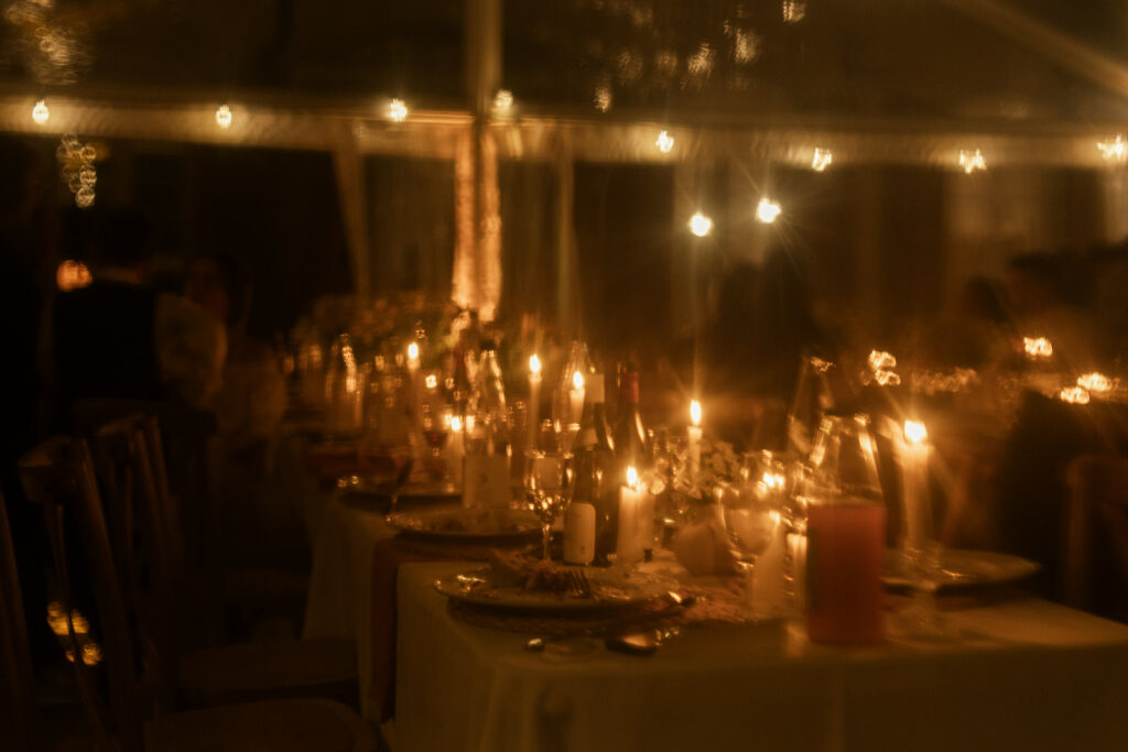 Candlelit wedding dinner atmosphere during a destination wedding weekend in France