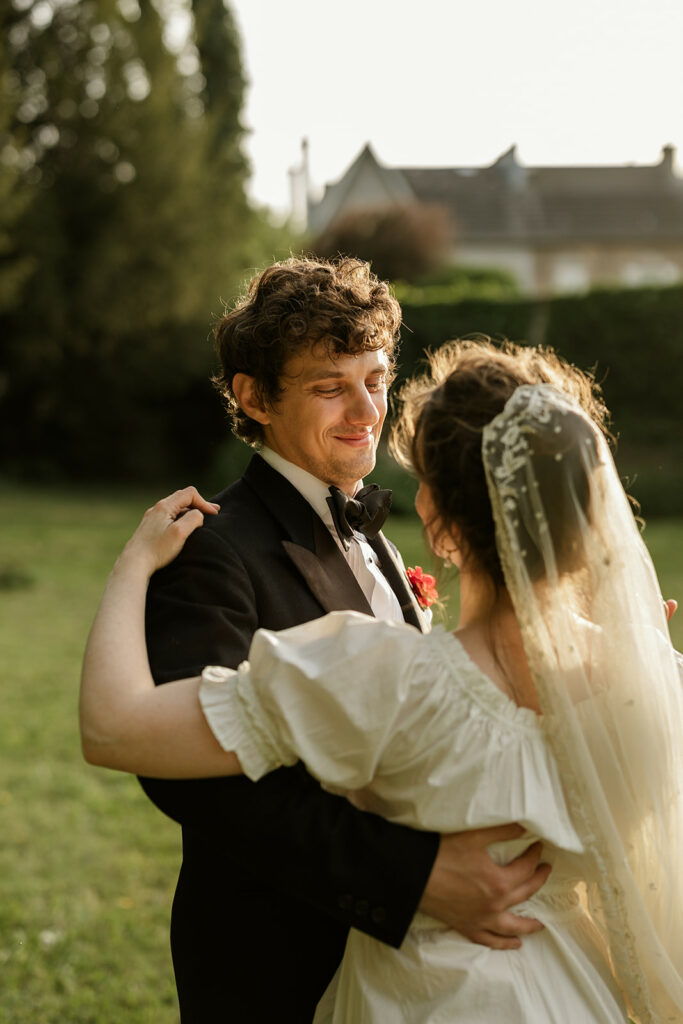 Bride and groom dancing together at sunset during a destination wedding in France
